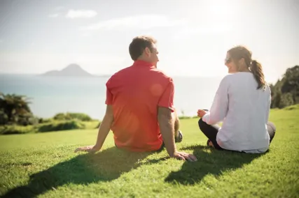 Screen grab from the video of people sitting on a hill