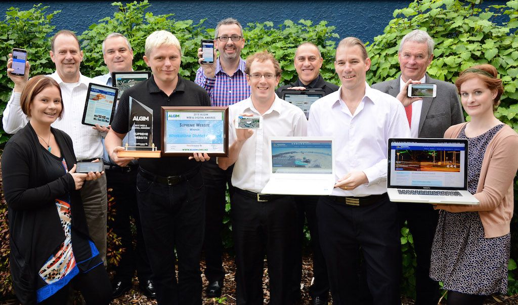Pictured with the ALGIM supreme website award and a range of the devices which can access the Whakatāne District Council website are (from left): Nicola Dobson, Paul Allington, Stephen O’Leary, Chris Rawson, Brian Elliott, Casey Box, Julian Reweti, Justin McGeough, Ross Boreham and Sarah Travers.