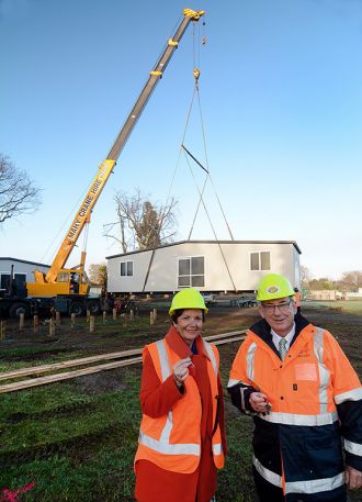 The Hon. Anne Tolley and Whakatāne Mayor Tony Bonne with the keys to the first relocatable buildings.