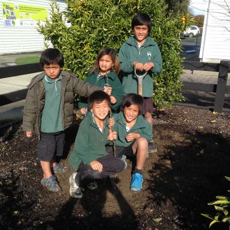 Children from the James Street School planted one of the peach trees.